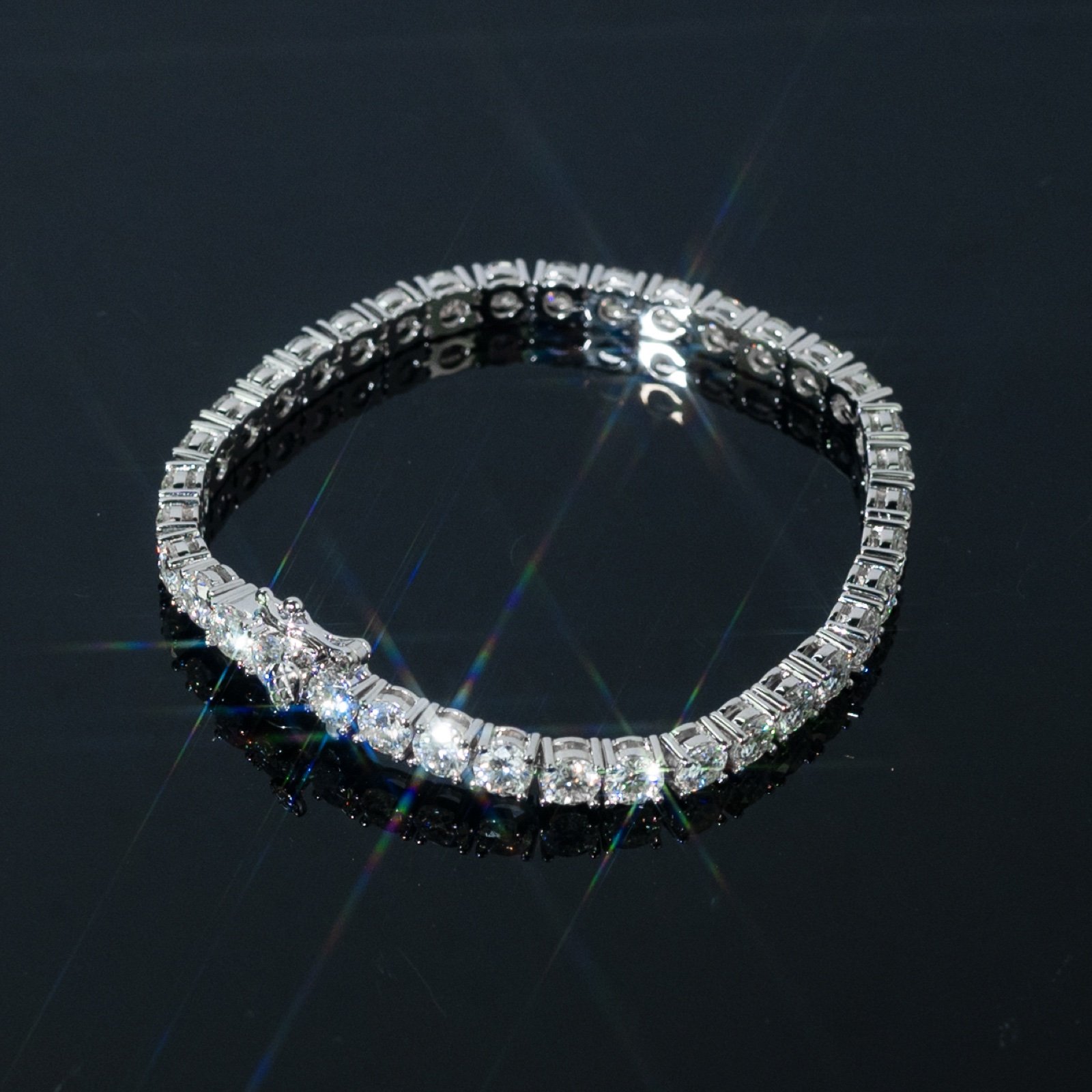 5mm tennis bracelet on a dark reflective surface